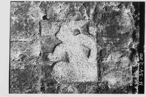 Structure I - west, sculptured stone in wall