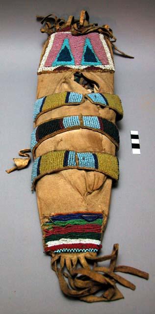 Plateau toy cradleboard of wood covered w/ army cloth. U-shaped w/ beadwork