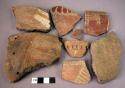 7 red burnished potsherds with incised or incised & punched decoration; sometime