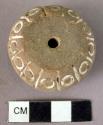 Pottery spindle whorl with incised  and colored designs