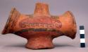Polychrome pottery jar with flaring base and spout - eccentric shape