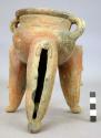 Pottery dish, tripod, colored, legs hollow and carved