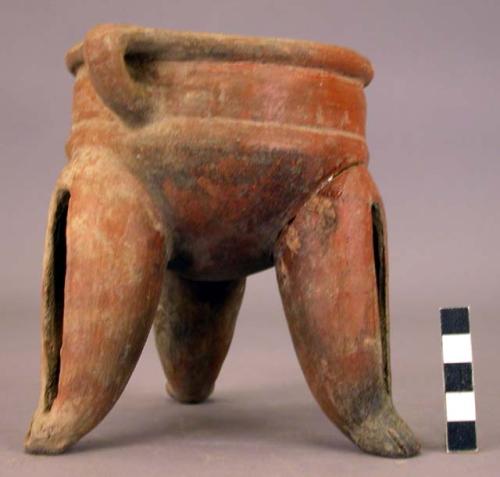 Pottery dish, tripod, legs hollow with clay balls