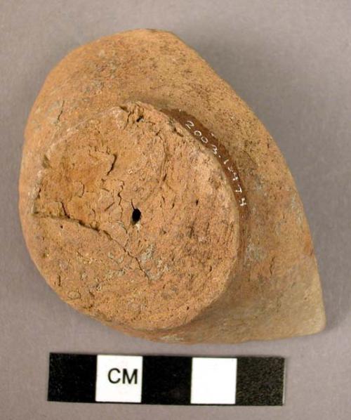 Ceramic base sherd, undecorated orange ware, string cut