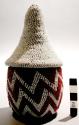 Basket w/conical lid; woven veg. fiber; red & white zig zag glass bead dec'n