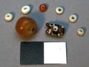Glass beads, round (clear orange), tubular (polychrome) & discoidal (white & ora