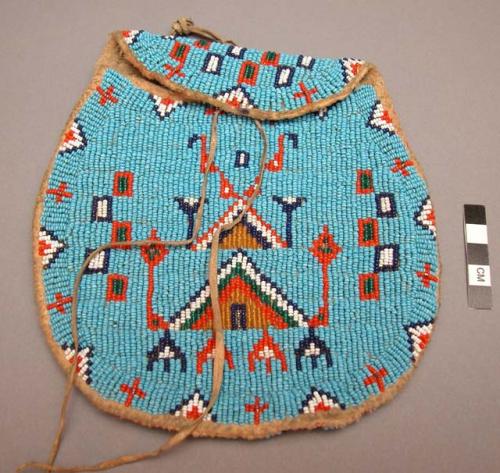 Skin pouch with closing flap, covered with bead decoration