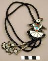Silver bolo in form of thunderbird inlaid with different materials