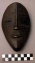 Small wooden face mask.