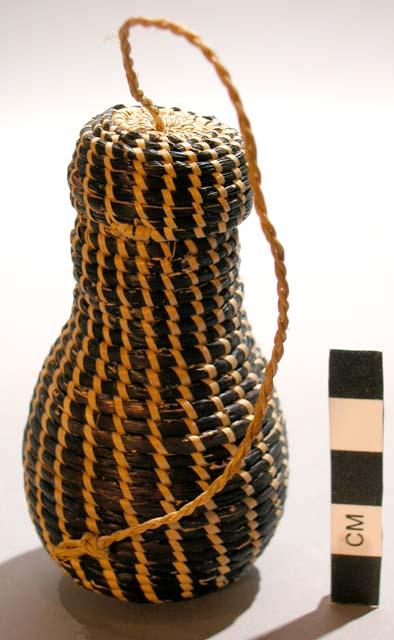 Basket w/lid; coiled dk & nat. veg. fiber; rounded body; tapered neck