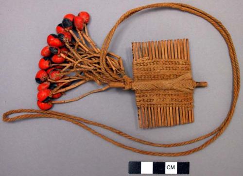 Dorsal neck pendant - red wooden comb with black and red bead pendants;  ceremon