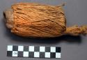 Raffia covered pottery whistle, used to create voice of the "Ge"