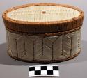 Oval covered birch bark container decorated with quills