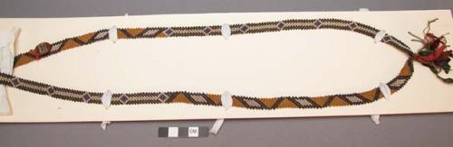 Ponca necklace. Narrow band of beads, bias-weave,  remnants of beads and ribbon.