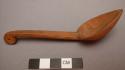 Small curved wooden spoon