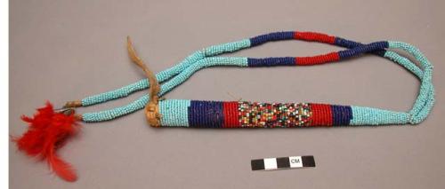 Beaded whip with two beaded thongs