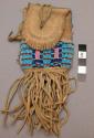 Plains beaded pouch, possibly Sioux. Buckskin w/ brass button. Beaded in yellow,