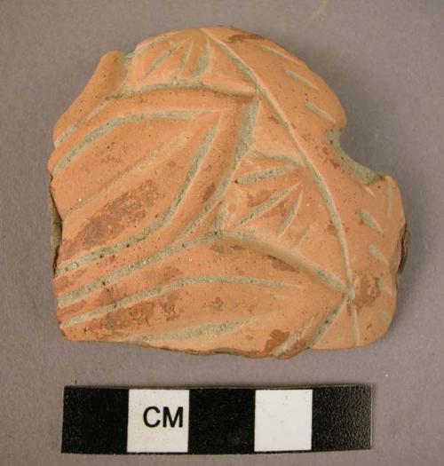 Pottery fragment; baked clay; lotus motif.