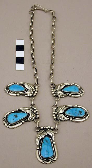 Necklace, silver links from which 5 turq. pendants are suspended