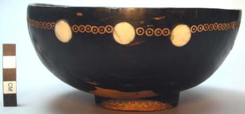 Large wooden bowl inlaid with bone