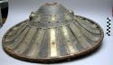 War shield. 20.5 in. dia., round conical shaped shield with outward flare edges,