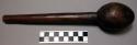 Wooden pounder, carved indentations, length 11.625 in.