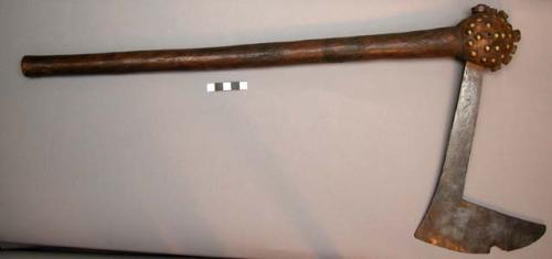 One axe with wooden handle and iron blade bulbous head with hob-nails