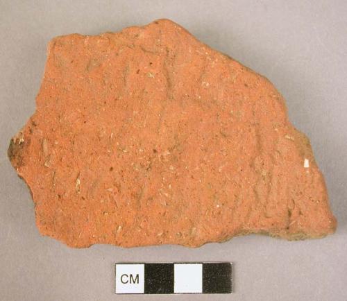 2 potsherds - coarse worn red ware, unsmoothed