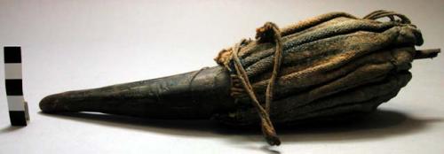 Horn filled with medicine; burnt handle