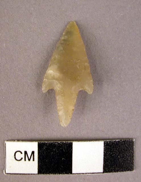 Chipped stone projectile point, grey, stemmed, triangular blade