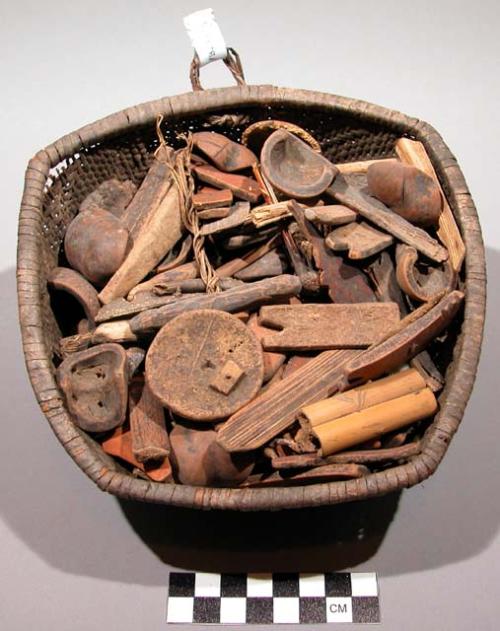 Medicine bundle, woven basket containing various divination items