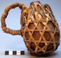 Gourd milking jug, basketry