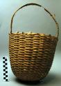 Basket used for hoisting earth out of graves and pits