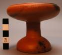 Dish, pedestal base, inward curving lipped rim, incised designs