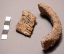 Ivory bracelet found in position at armbones (fragmentary)