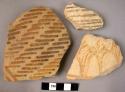 Ceramic body sherds, buff ware with painted linear design