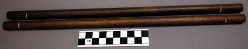 Sticks, very new, stained brown, with notches cut in each end