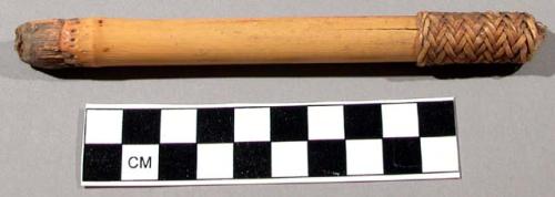 Unclassified tool, section of hollowed bamboo, 1 end with basketry band