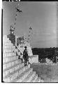 Native Maya boy on stairway at Temple of Warriors