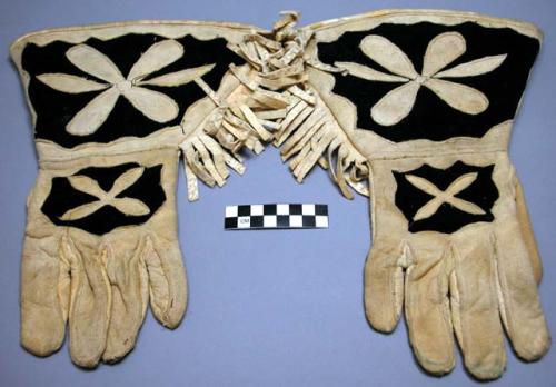 Man's buckskin gloves, fringed.