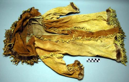 Child's coat, possibly Thompson River. Full length coat w/ fringe along bottom,