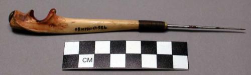 Shoshone awl. Bone handle w/ long metal point inserted into it.