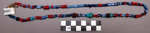 Paiute necklace. A variety of glass beads strung on string.