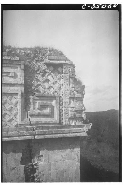 Mask-panel serpent motif. N.W. corner of West House, Monjas Quadrangle.