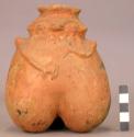 3-lobed pottery human effigy jar with animal (?) on the back.  Light brown, prob