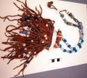 Crow necklace. Glass trade beads, brass beads, hooves, shell, and fringe.