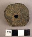 Disc with center hole, pottery