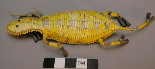 Sioux quilled umbilical amulet. Amulet in shape of horned lizard. Yellow and blu