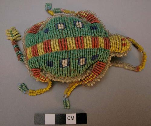 Sioux navel amulet in shape of turtle. Top is covered w/ lazystitch beadwork. Ce