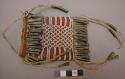 Sioux bag. Bag made from red trade flannel. White and blue beadwork in diamond s